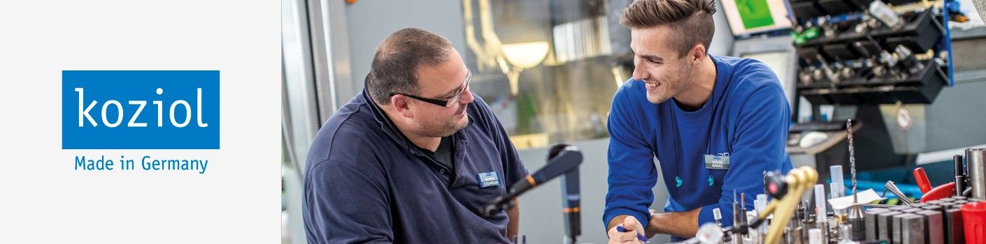 Two guys in manufacturing are talking