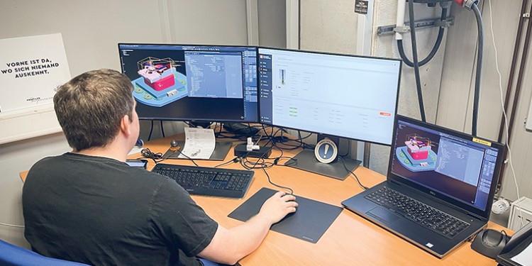 employee sits on his desk