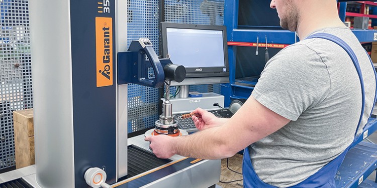 Employee scans RFID chip on his tool