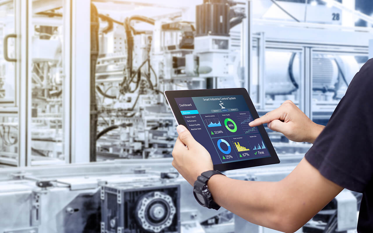 Man typing on tablet on the shop floor